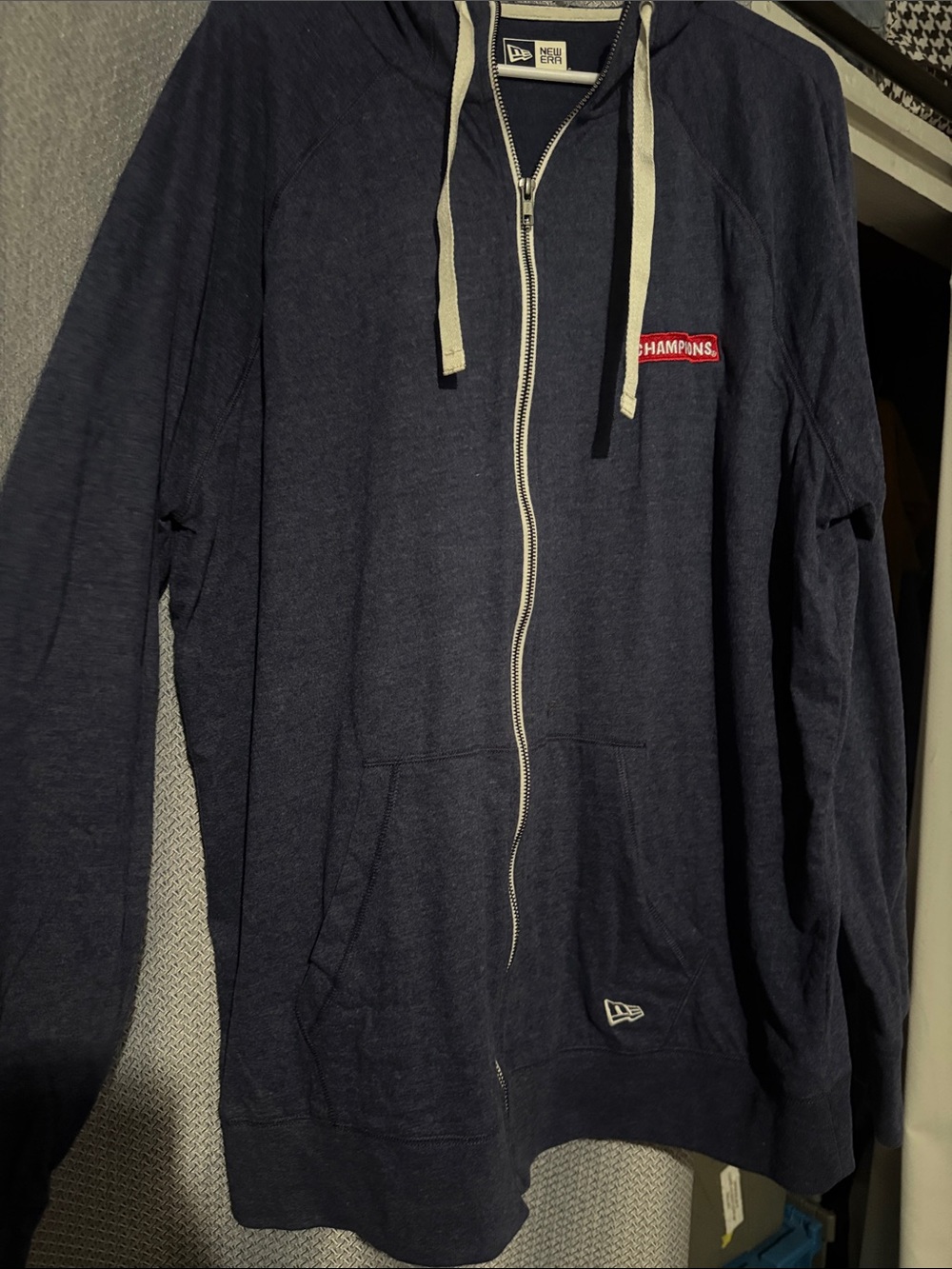 New Era Men's Navy Zip-Up Hoodie with 'Champions' Patch